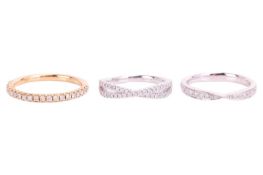 Three diamond-set wedding bands in 18ct gold; to include a diamond pavé-set half-eternity ring in 18