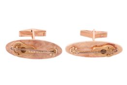 A pair of Baroque guitar cufflinks, elongated oval panels with a cross-hatched finish ground, applie