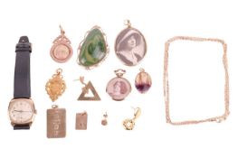 A collection of 9ct gold jewellery and a 9ct gold watch, featuring two ingot pendants, three loose e