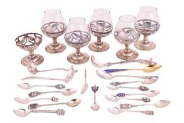 A small group of assorted souvenir spoons with enamel finials; and a set of six cordial glasses in w