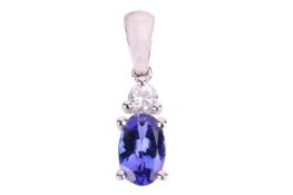 A tanzanite and diamond pendant, claw-set with an oval-cut tanzanite below a brilliant-cut diamond, 