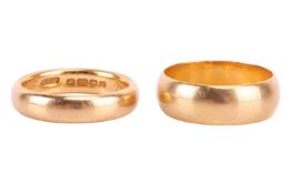 Two 22ct yellow gold bands, the first a 4mm court shape band, the inner band engraved with initials,