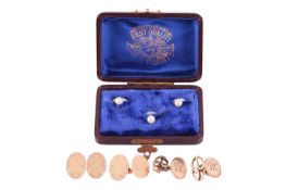 Two pairs of gold cufflinks and a box of dress studs; to include a pair of monogrammed oval panel cu