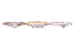 A group of three diamond rings, including a diamond single stone ring, set with an old cut diamond i