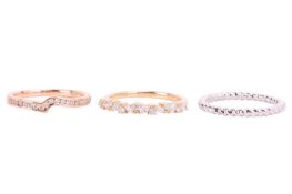 Two diamond-set rings in 18ct gold and a wedding band; to include a stylised half-eternity ring in 1