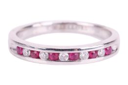 A ruby and diamond half-eternity ring in 18ct white gold, channel-set with alternating circular-cut 