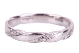 A diamond-set wedding band in 18ct white gold, of twisted design, with alternating segments embellis