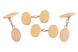 Two pairs of cufflinks, comprising a pair of oval cufflinks with guilloché engraving, with maker's m