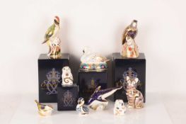 A collection of Royal Crown Derby paperweights comprising, a boxed Bronzed Winged Parrot, Green Wood