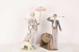 Lladro: A pair of figurines comprising The Wine Taster (5239) and Lady with a Shawl (4914), the tall