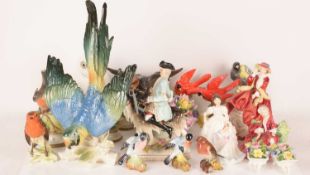 A large mixed collection of figurines, comprising a 20th-century Dresden porcelain figure titled Cou