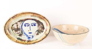 Lluis Castaldo (1936) Spanish, a large ceramic oval dish with the face of a woman in blue, 46 cm wid