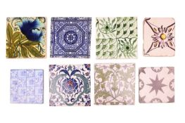 A collection of decorative tiles, 19th century and later, to include examples by Wedgwood, Pilkingto