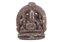 An Indian hardstone carved figure of Ganesh sitting on a double lotus socle, 20th-century, measures 
