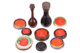 A collection of 19th-century wax seals, some boxed, together with two hardwood press seals, the larg