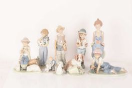 Lladro: A collection of figurines comprising a Pocket Full of Wishes (7650), Fisher Boy (4809), My B