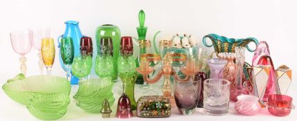 A large colourful collection of glassware and decorative items comprising; a 20th-century green and 