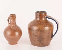 A salt glazed stoneware Bellarmine jug, the spout with bearded man, incised 'H' to base, 19.5 cm hig