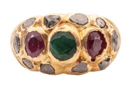 A gem set yellow metal ring, featuring emeralds, rubies and diamond chips rub over set into yellow m