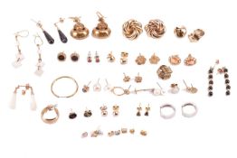 A collection of earrings; to include examples of a pair of late Victorian drop earrings in Etruscan 