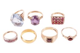 A collection of seven rings comprising an amethyst ring, in yellow metal tested as 9ct, size P1/2, a
