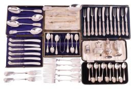 A cased set of eleven Elkington teaspoons, a cased set of six coffee spoons and sugar tongs, three s