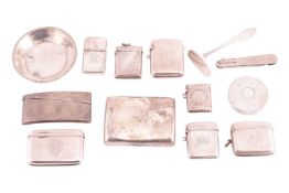 Seven silver vesta cases, a curved cigarette case engraved with a monogram, a curved silver card cas