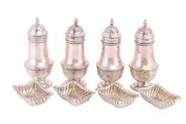 A set of four silver pepperettes of baluster form by Herbert Charles Lambert, London 1910-1913; toge