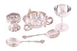 A lobed bowl with three scrolled handles, a champagne goblet, a small lobed stemmed bowl, a pair of 