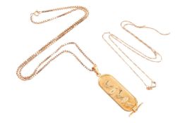 An Egyptian revival yellow metal pendant and chain, together with a broken fine chain. The Egyptian 