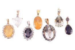 A collection of seven gem-set pendants; to include a large chequerboard-cut topaz surrounded by synt
