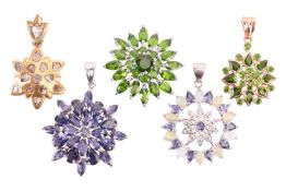 A collection of five gem-set cluster pendants, including an iolite floral cluster pendant measuring 