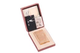 An S T Dupont De Paris gold plated lighter in a fitted box with original paperwork accompanied with 