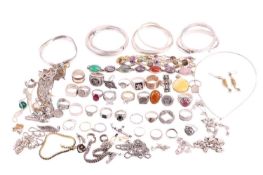 A collection of white metal jewellery items; to include examples of an egg yolk Baltic amber pendant