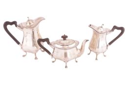 A matched three-piece tea service; comprising a hot water jug by Mappin & Webb, Birmingham 1912,