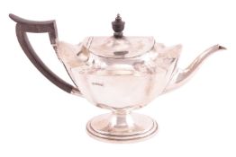 A large silver teapot by Mappin & Webb, Sheffield 1910, of hexagonal lobed form on an oval stepp