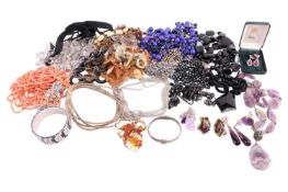 A large quantity of costume jewellery; consisting of quartz necklaces, bracelets, heavy beaded neckl