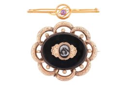 Two brooches; comprising an amethyst and diamond bar brooch stamped '18ct', measuring 61mm in length