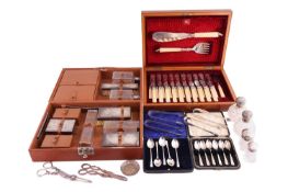 A gentleman's dressing case with silver mount brushes in a pig skin leather box; a boxed set of fish