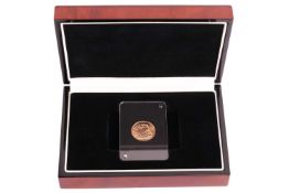 A George V sovereign, 1925, issued by the London Mint, in presentation case with certificate.