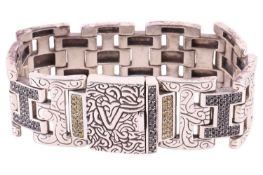 Versani - a heavy link bracelet set with black and yellow diamonds, wide hinged links engraved with 