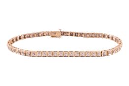 A 9ct gold tennis bracelet, featuring white stone set sections in yellow metal hallmarked 9ct gold w