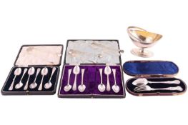A small quantity of silver; to include a George III silver sugar basket with swing handle by Peter, 
