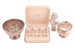 A cased set of six silver teaspoons, a silver rose bowl embossed and chased with floral scrollwork d