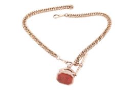 An Albert chain and fob, the yellow metal curb link chain stamped 9ct with a rolled gold T-bar fitti