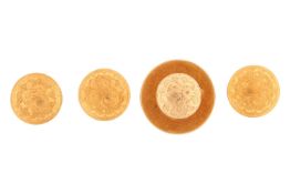 Three matching shirt studs and one larger stud hallmarked 18ct gold. 7.15g.