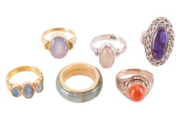 A collection of six gem-set rings; to include an oval-cut blue chalcedony dress ring in mount marked