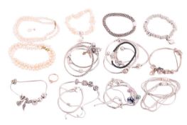 Twenty one Pandora bracelets, some with charms, a Pandora heart cluster ring, size L½, two Links of 