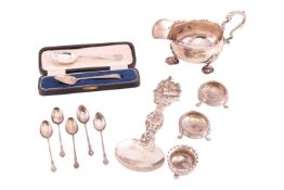 A mixed collection of silver items; to include a German 800 standard casted galleon serving spoon, a