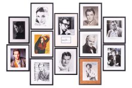 A large group of framed and signed celebrity photographs, comprising: Woody Allen, Kevin Costner, Ew